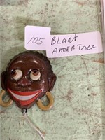 Black americana Mechanical Brooch Marked made in