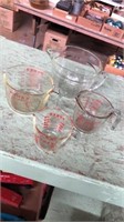 4 measuring cups. Anchor Hocking 8 cup, Pyrex 4