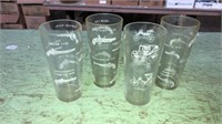 4 vintage drinking glasses with guns and coaches