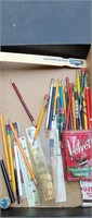 Lot of pencils rollers and a pipe and cigarette