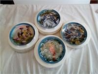 Four pretty bird Danbury mint collector plates.