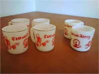 6 Tom and Jerry mugs.  White glass. 2 are