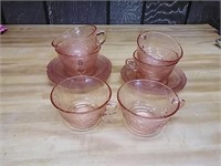 Pink / red glassware cups and saucer lot.