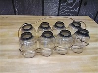 8 glasses with a vintage serving holder.