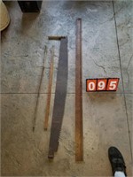 antique measuring sticks and 2 man saw