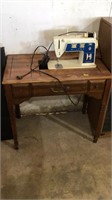 Singer Sewing machine w/cabinet