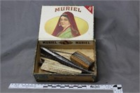 Muriel cigar box containing assorted saw blades