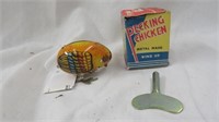 VINTAGE METAL WIND-UP PECKING CHICKEN TOY WITH