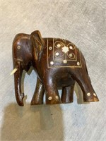 vintage elephant made of wood with bone inlaid
