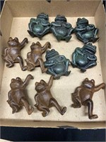 10 cast-iron frogs all 3 inches tall. The brown