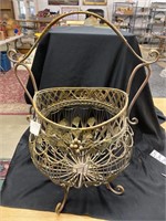 Basket planter with ginkgo leaf decorations.