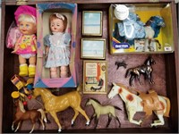 Case lot of dolls and figurines                  (