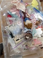 Lot with 2 plastic totes with doll clothes, perfum