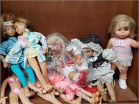 Shelf lot with different size and make dolls, batt