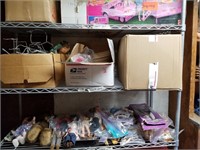 Shelf lot with dolls clothes, doll metal stands, m