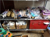 Shelf lot with different sizes dolls, doll clothes