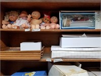 Shelf lot with cabbage patch dolls and 16" Brikett