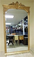 Grand Crown and Crest Topped Gilt Beveled Mirror.