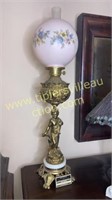 Brass cherub lamp with pink handpainted globe