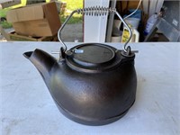 cast-iron teapot approximately 9 inches across