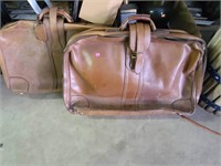 2 vintage leather suitcases leather needs cleaning