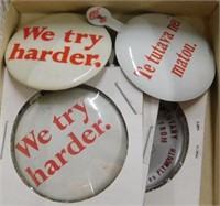 Avis We try harder buttons: one in foreign, a pin
