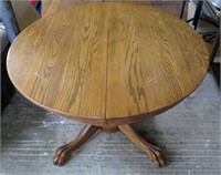 Oak Pedestal Table: claw feet; worn; edge warped