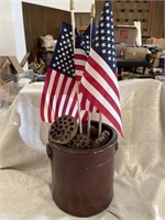 Crock with decor and flags inside