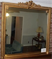 Gold framed mirror approx. 50" tall by 50" wide