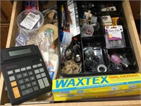 Contents of drawer. Calculator organizing items