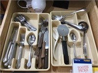 Contents in drawer silverware and measuring cups