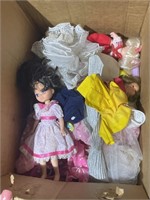 Box of Dolls and Doll Clothes