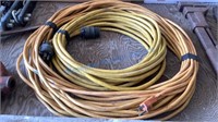 TWO YELLOW EXTENSION CORDS