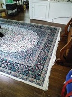 10.9 by 7.7 floor rug