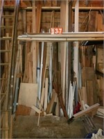 lumber on back wall. barn wood trim spindles misc