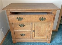 Oak washstand with raised panel sides and back