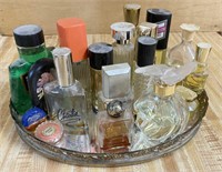 Variety Of Perfume On Mirror Tray