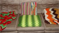 3 crocheted blankets and pillow