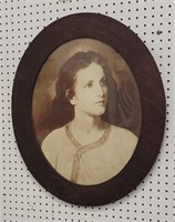 Oval frame with woman