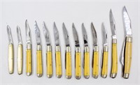 Lot (13) KABAR Yellow Handle Folding Pocket Knives