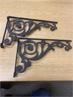 Two cast-iron shelf or plant hangers. 12” x 7