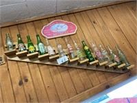 13 vintage glass beverage bottles, shelf, duck hun