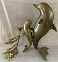 Brass dolphin statues