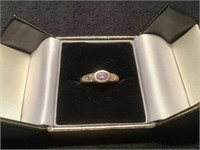 10 kt gold ring with purple stone
