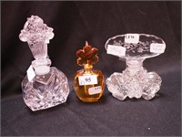 Three decorative perfume bottles: