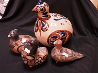 Four pottery birds ranging in size from 4 1/2"