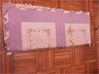 Vintage handsewn quilt with embroidered