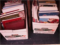 Two boxes of books on quilting, sewing,