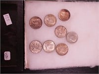 Seven Kennedy half-dollars and a 1945 Walking