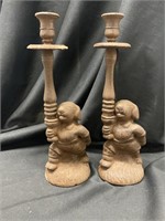 Two cast-iron dogs holding up candle stand. 12